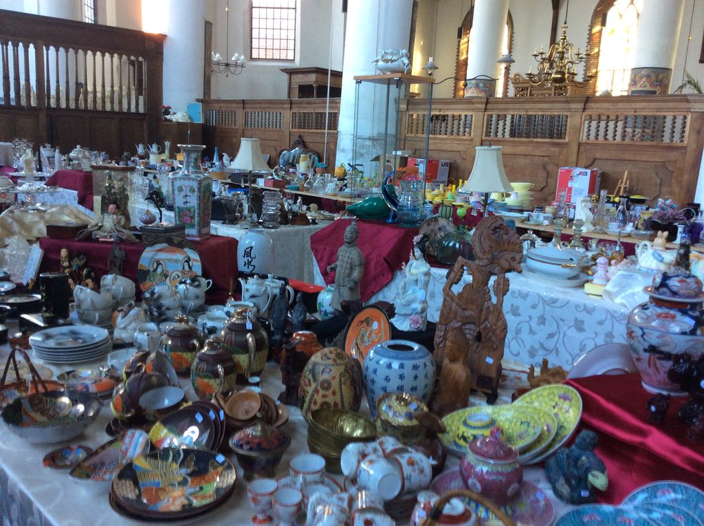 View of stalls in the church with pottery, figurines and wood carvings