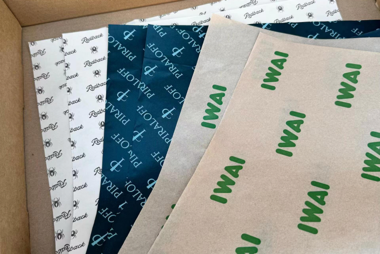 Custom tissue paper sheets with green logo print