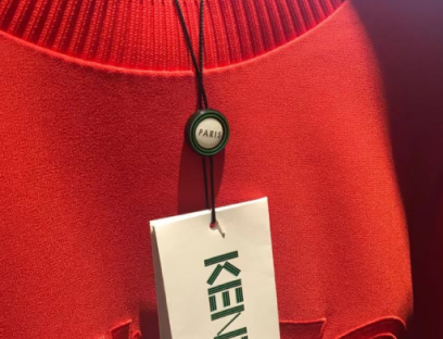 Custom paper hang tag attached to a garment
