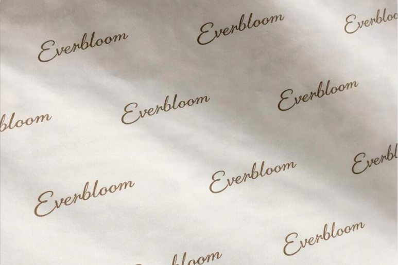 White tissue paper with repeating red logo print