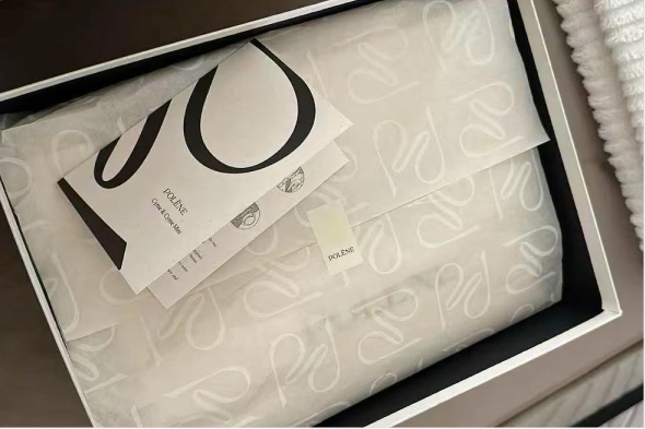 Polène packaging box lined with subtle white logo tissue paper