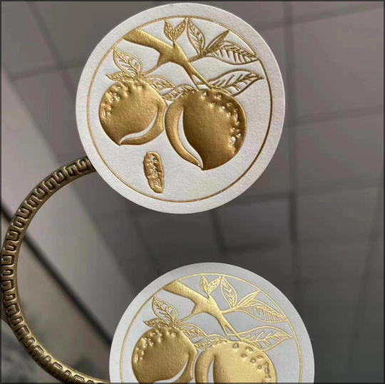 Gold foil stamped sticker on luxury packaging