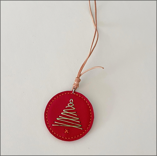 Embossed leather tag sample