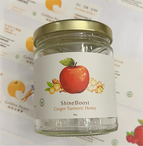 Custom product label applied to glass jar with fruit illustration
