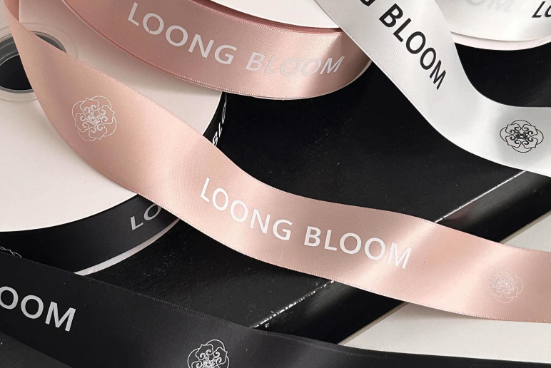Branded satin ribbon set with printed logos