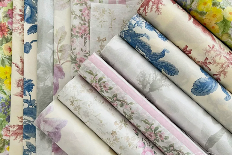 Stacked floral printed tissue paper sheets