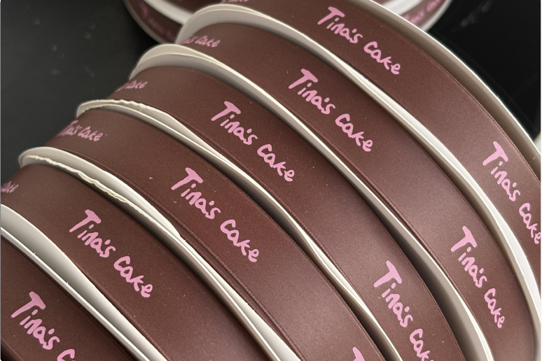 Printed ribbon rolls with repeating branding