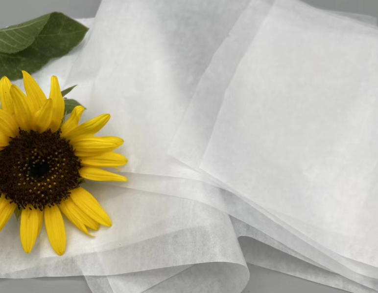 White tissue paper sheet with sunflower detail
