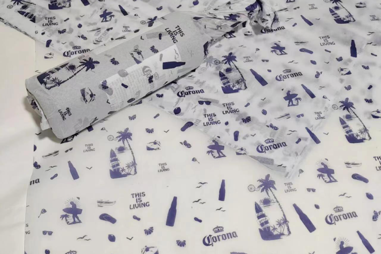 White tissue paper with blue toile-style print