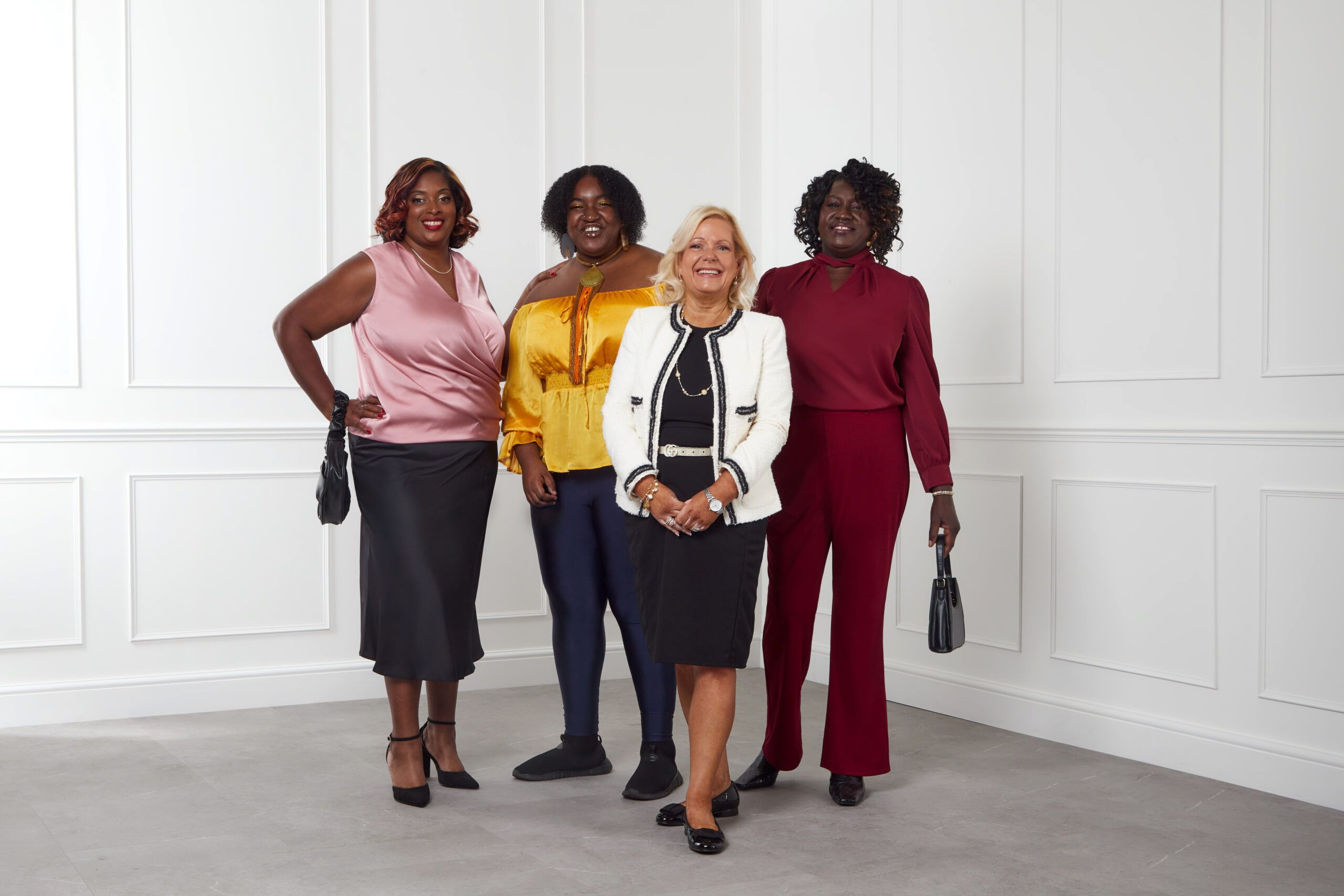 Four women posing for a picture