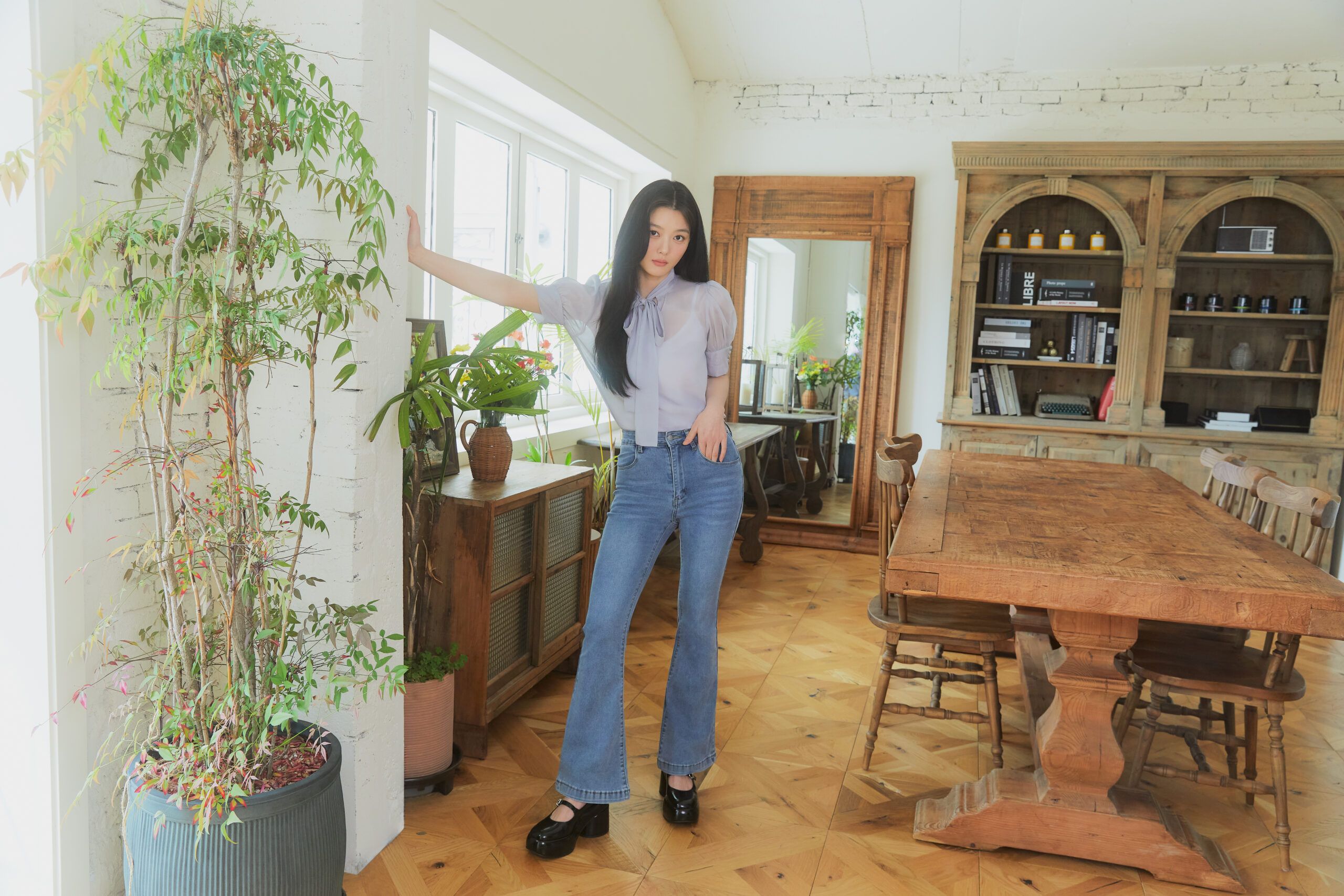 Kim You-Jung posing in a room