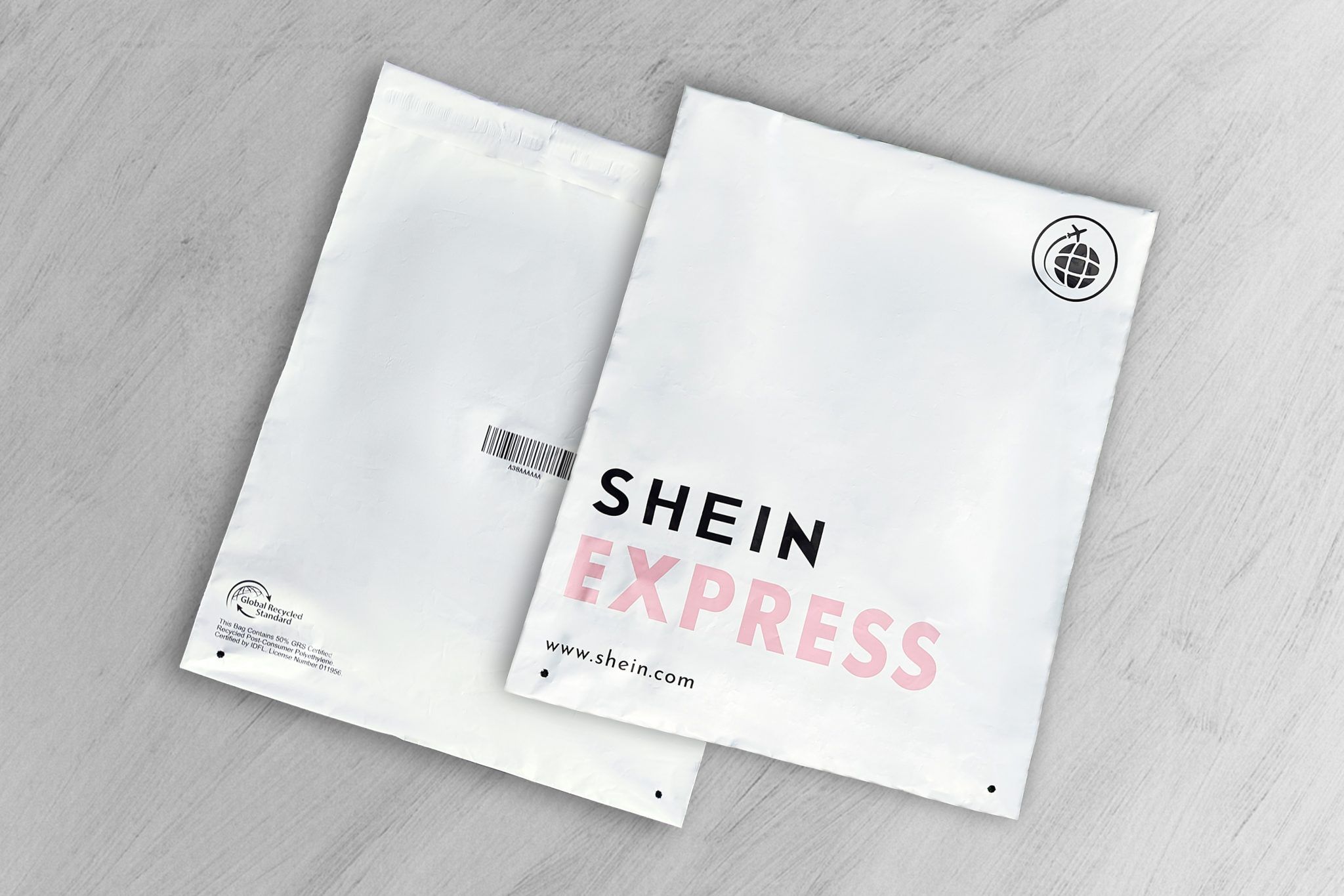 Two SHEIN Express shipping bags featuring branding and a recycled materials certification