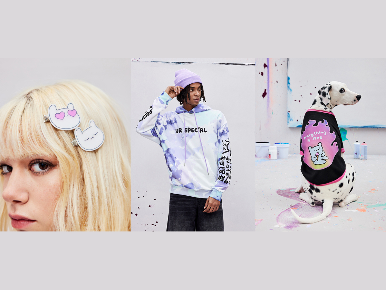 A woman, man and a dog posing in merchandise