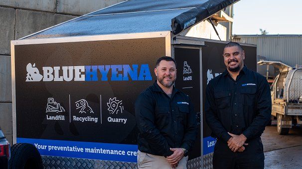 Adam and Dennis in front of the Blue Hyena maintenance trailer