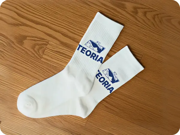 Socks with Teoria logo.