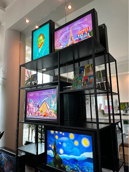 Illuminated Orange Panda 3D art panels with Van Gogh and Paris designs on a black shelf