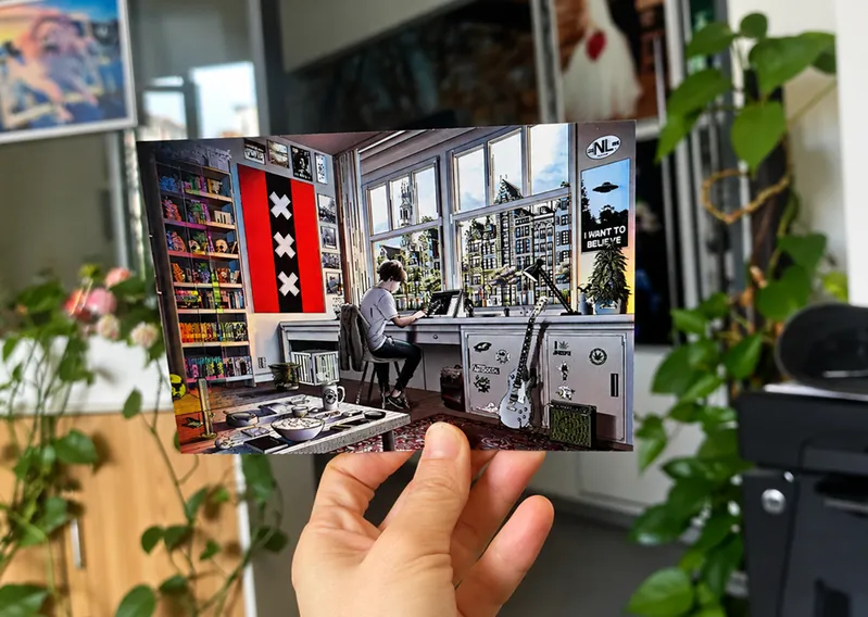 Hand holding an Amsterdam themed 3D postcard