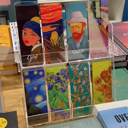 Lenticular Orange Panda bookmarks with Girl with a Pearl Earring, The Scream, Van Gogh and Starry Night designs on an acrylic display