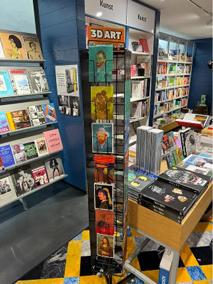 Spinner rack of Orange Panda 3D postcards in a bookstore art section