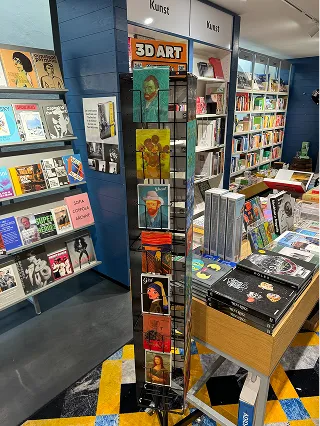 Spinner rack of Orange Panda 3D postcards in a bookstore art section