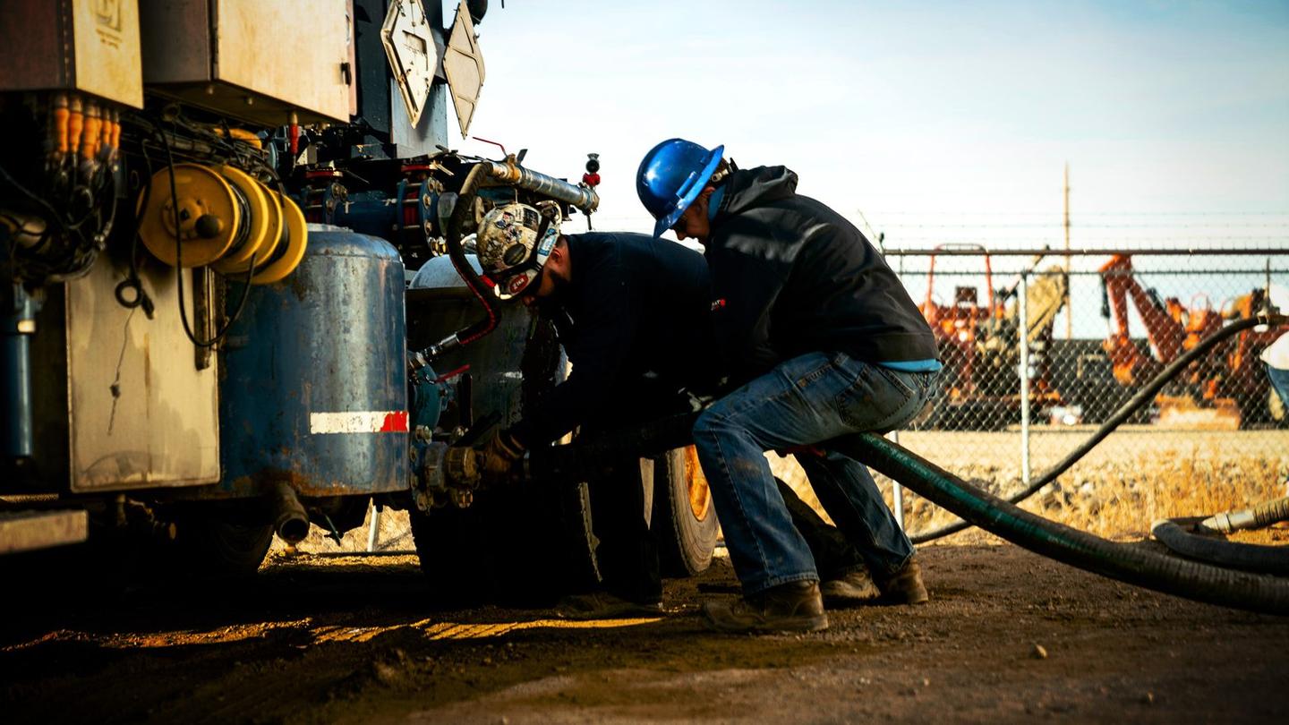 OneCor crew making up a hose connection on location