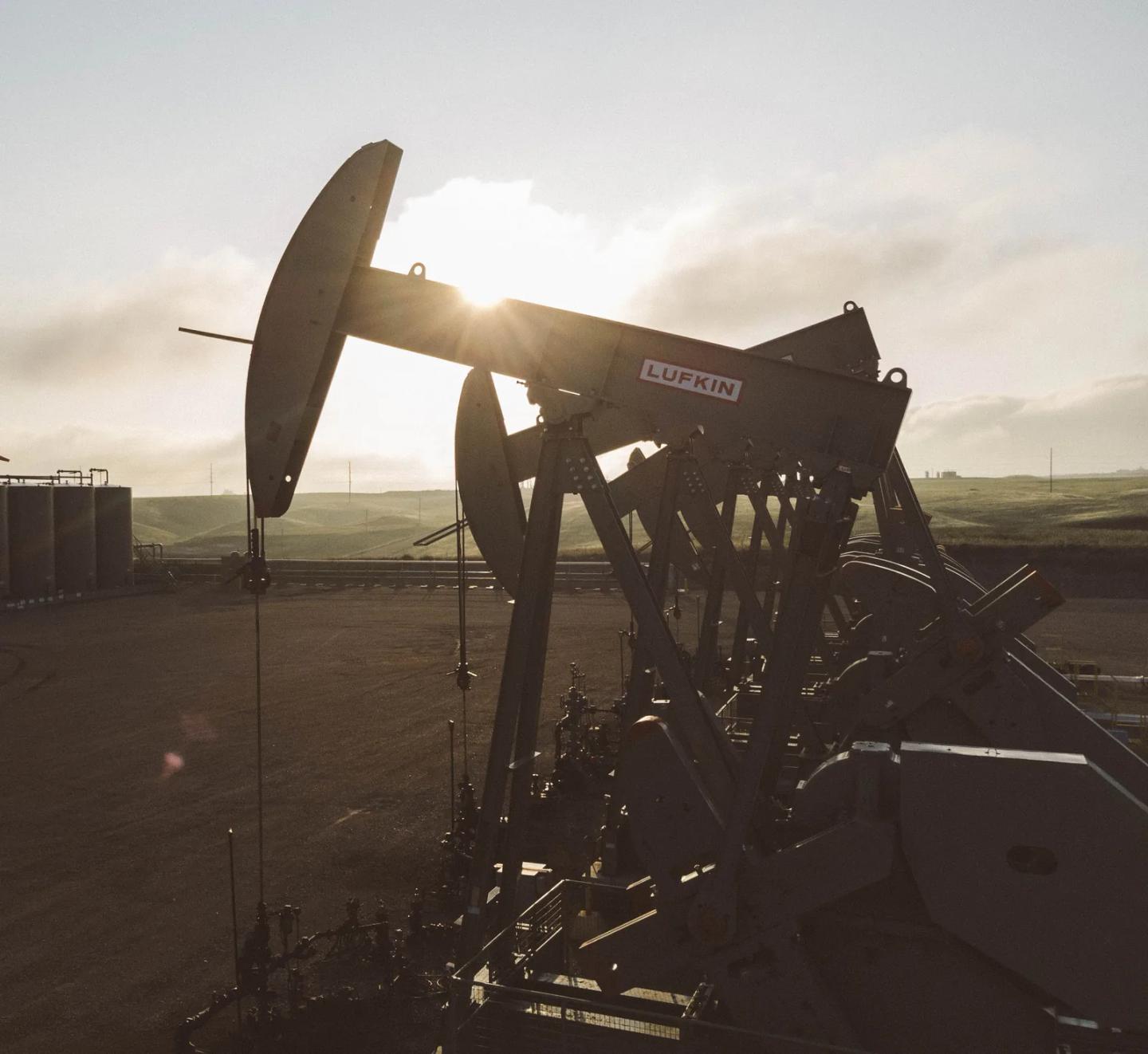 Pumping units on a producing pad at sunrise
