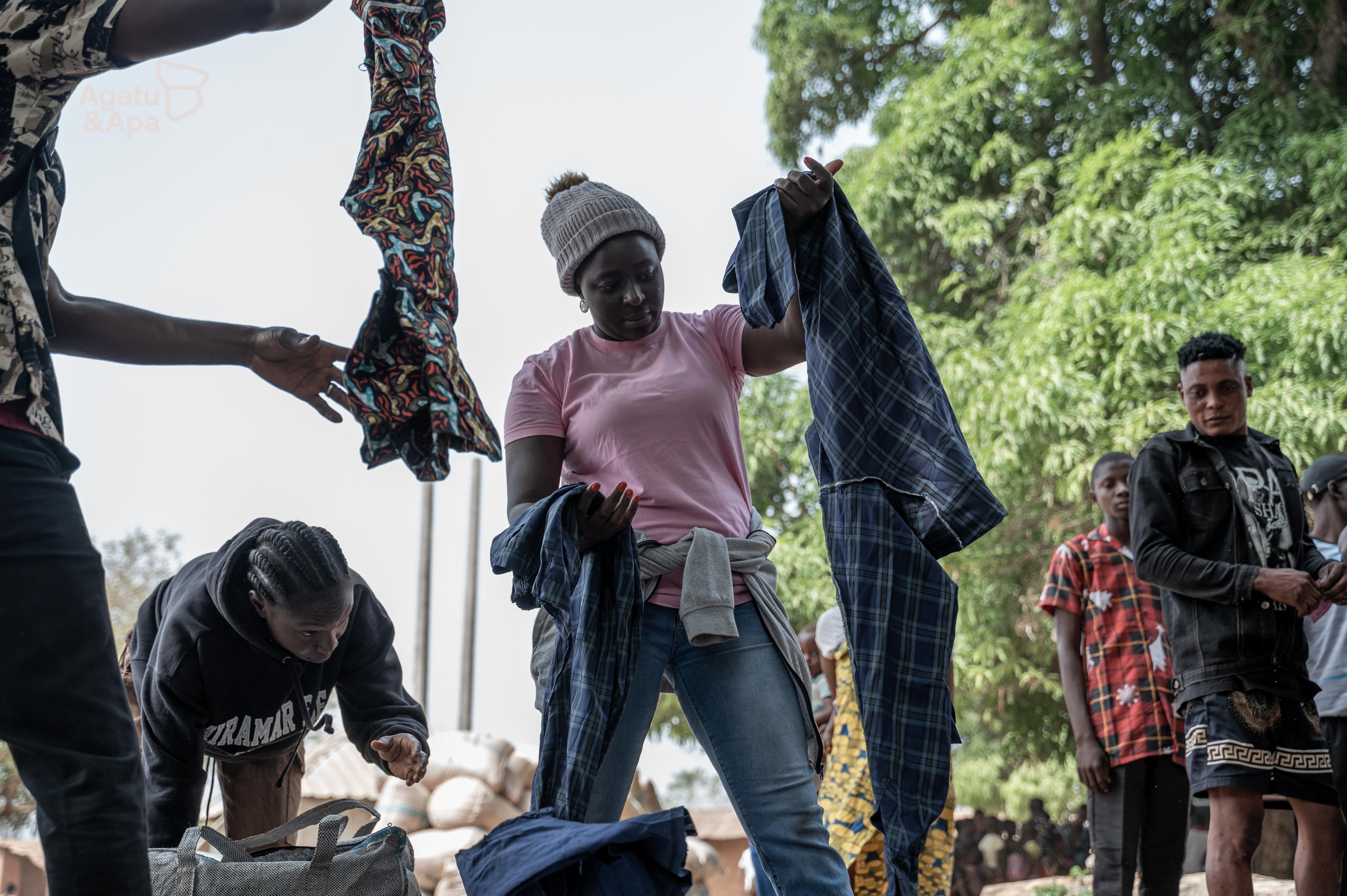 Our team distributing donated clothes to community members, bridging the gap for those who have lost so much.
