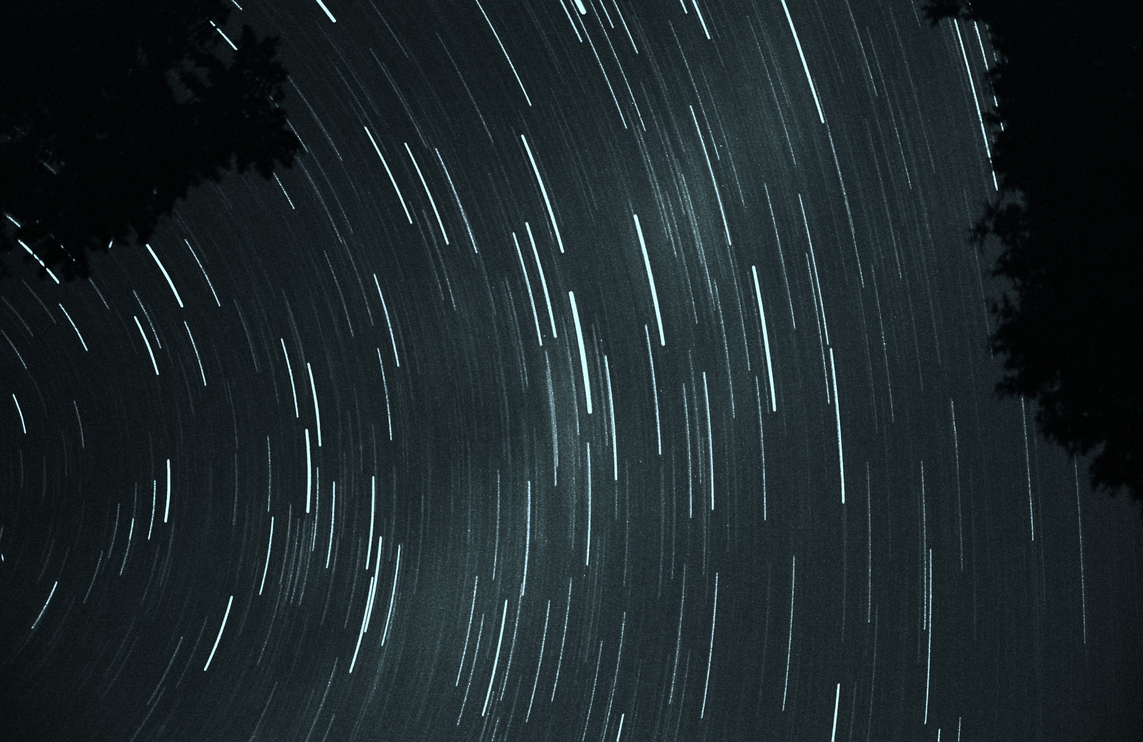 A monochromatic image of a speeding loop, representing the speed and infinite nature of the compounding effect of AI.