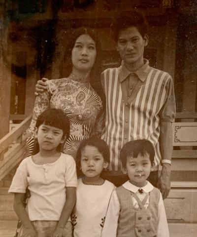 Me (bottom right), my parents, and two of my sisters in Vietnam before leaving.