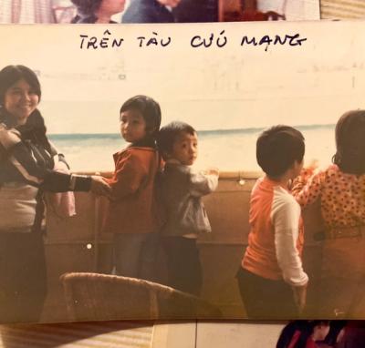 Me (far right), my mother (far left), and my siblings (middle) on the ship that rescued us.