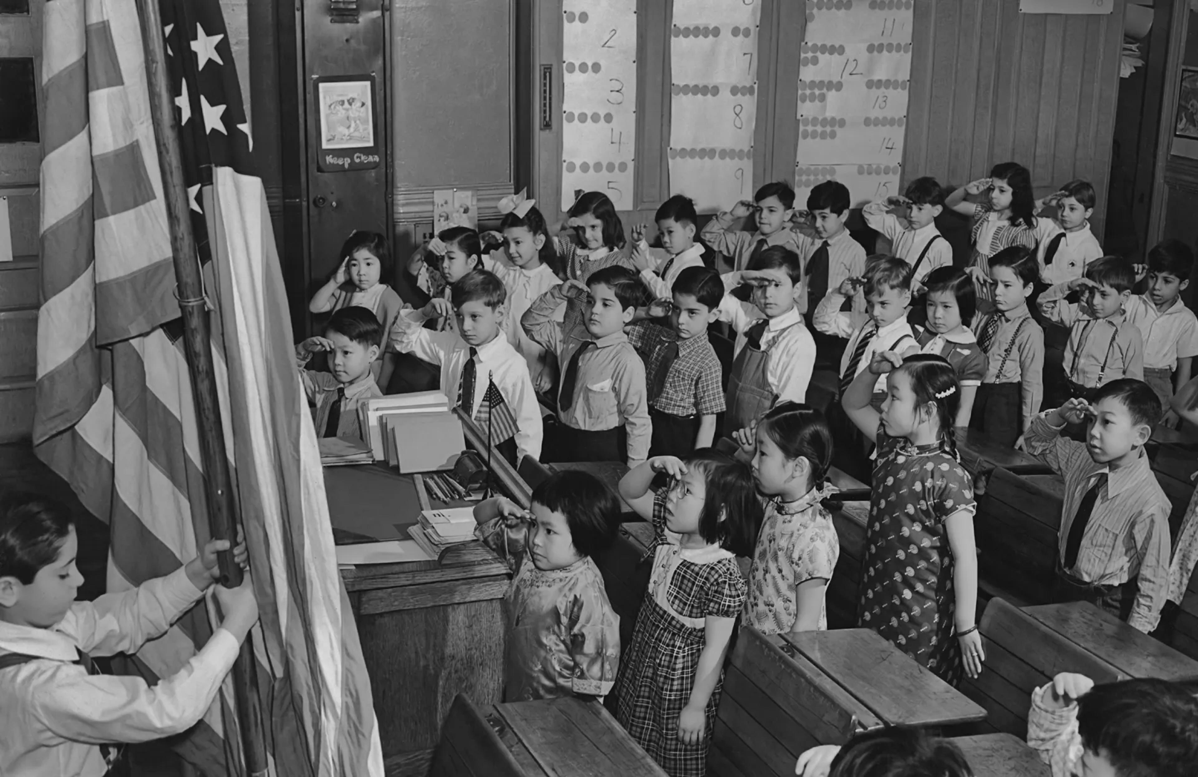 A group of children saluting the American flag at a school in the Chinatown area of Manhattan circa 1960.Keystone View/FPG/Getty Images