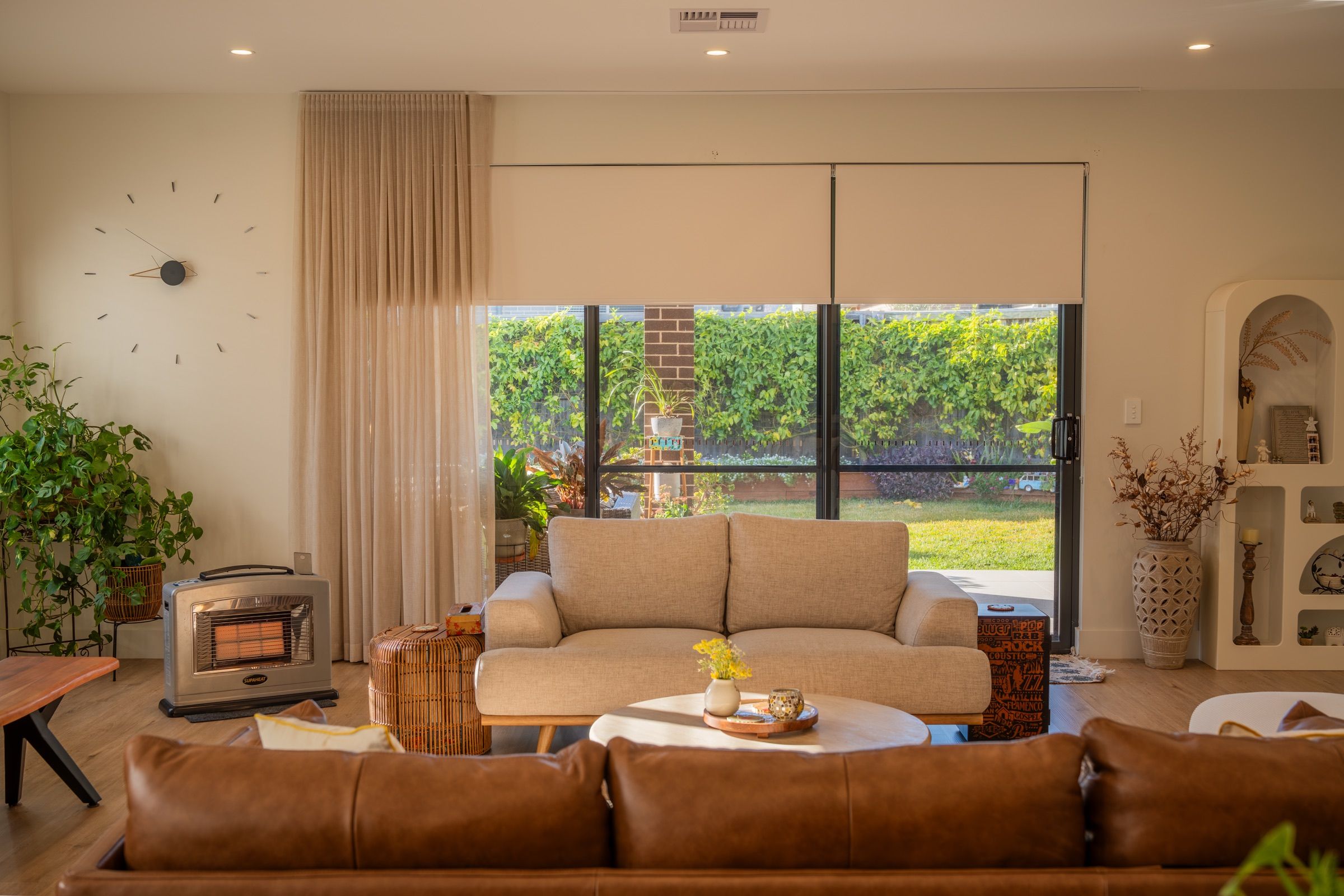 A run of blinds across a living area moves together in a few seconds.