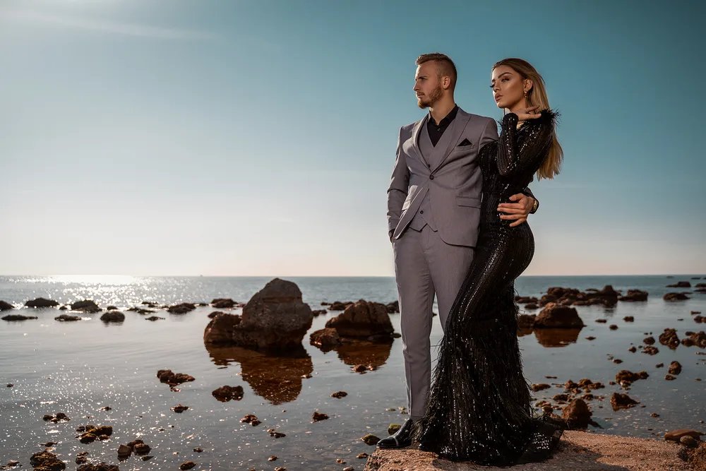Editorial portrait of a couple at the shoreline