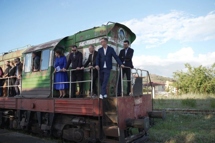 The Terminal creative team, including Ergys Shehu, on a disused railway locomotive
