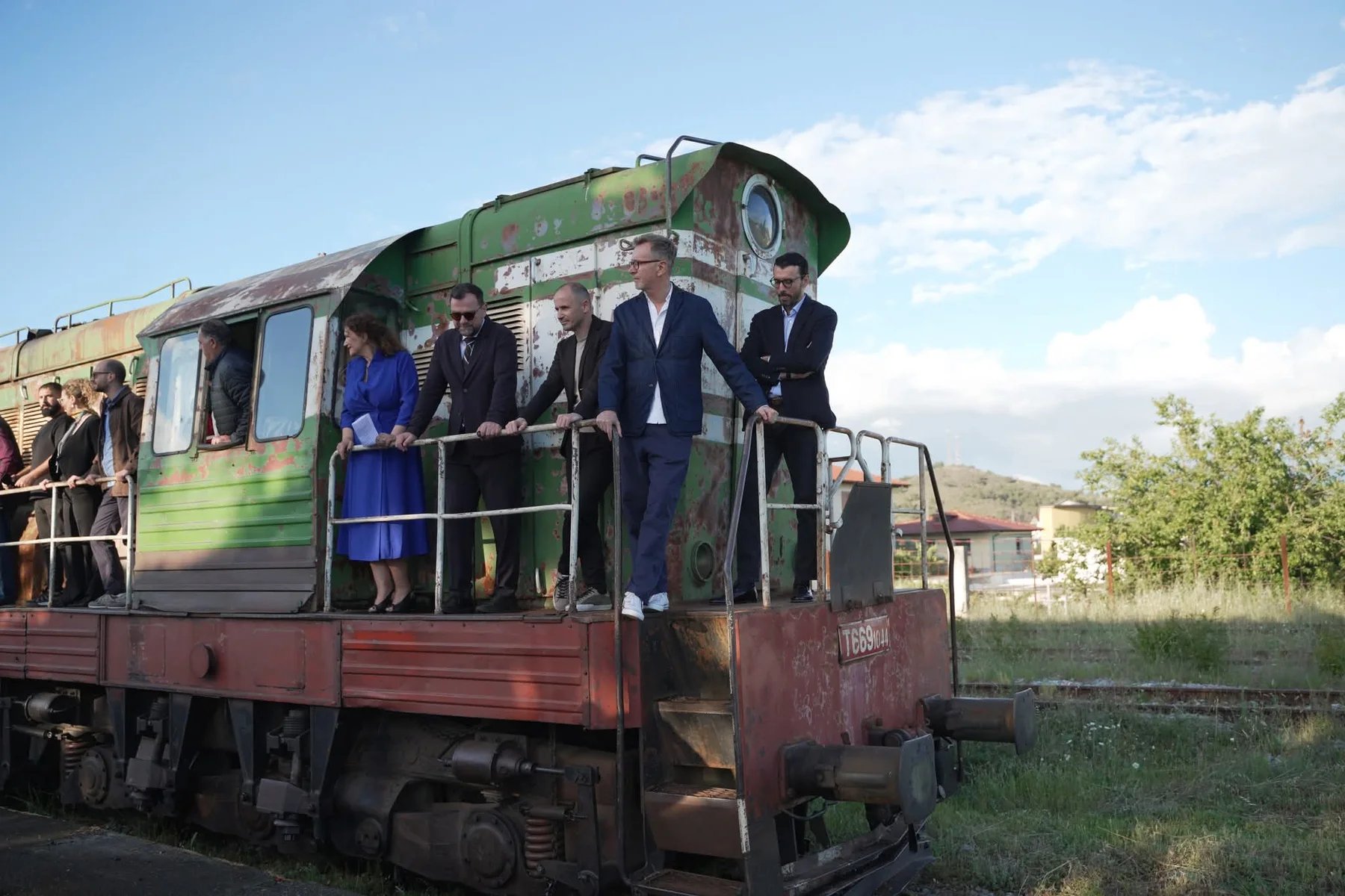 The Terminal creative team, including Ergys Shehu, on a disused railway locomotive