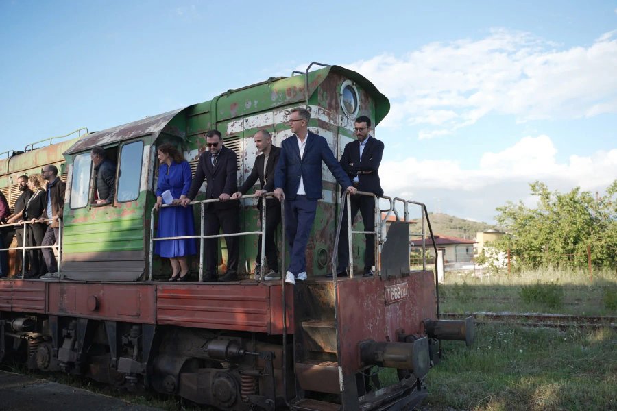 The Terminal creative team, including Ergys Shehu, on a disused railway locomotive