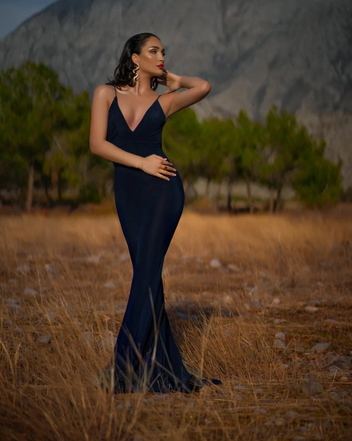 Editorial portrait at golden hour against mountains