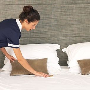 Maid making a bed