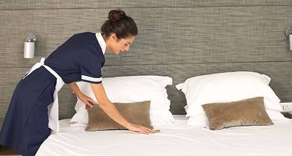 Maid making a bed