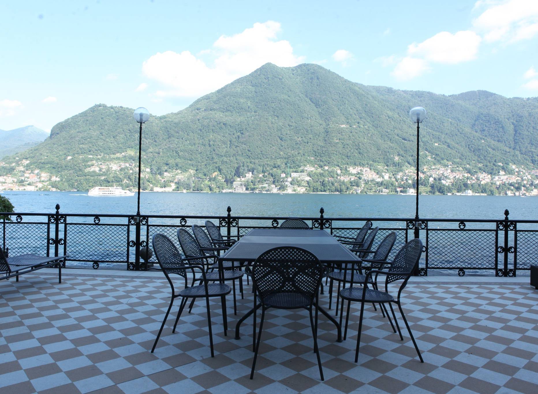 Terrace overlooking Lake Como. An example of luxury villa rentals in Italy