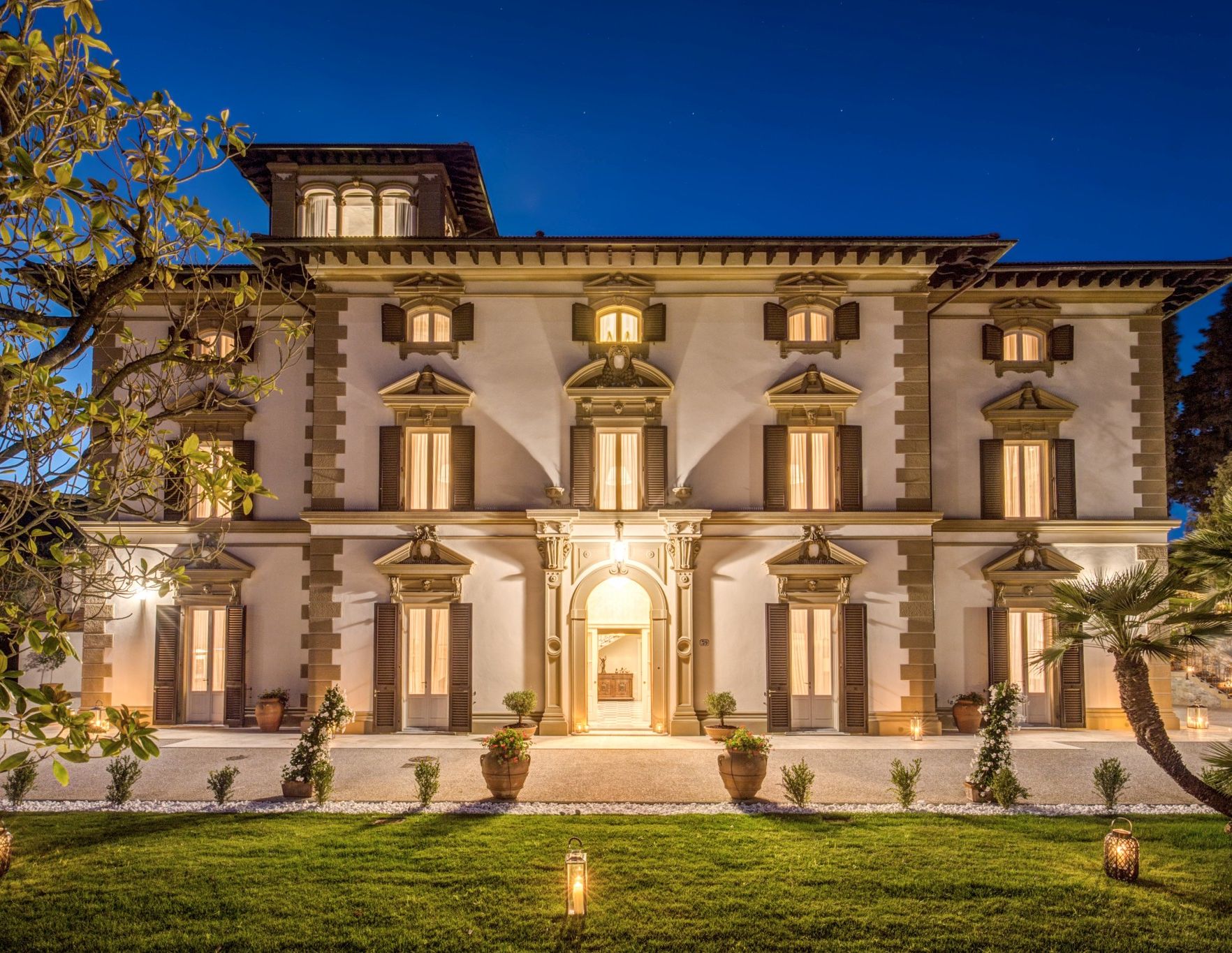 Illuminated luxury villa exterior in Tuscany