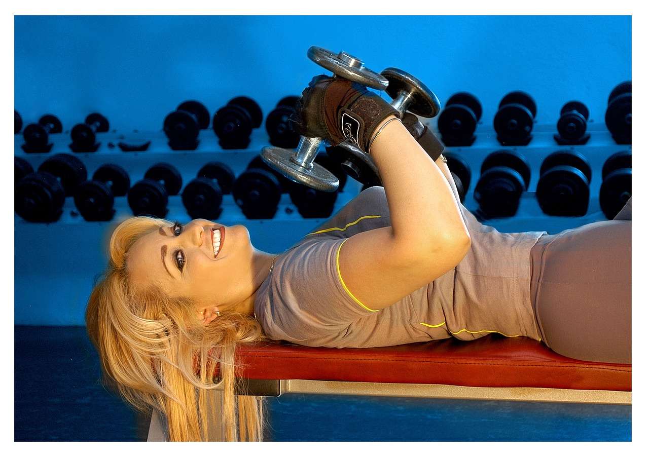 Woman performing exercises suggested by the personal trainer.