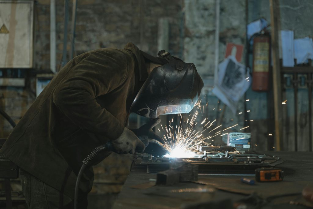 Studio DISOUL fabricator welding a spine staircase beam