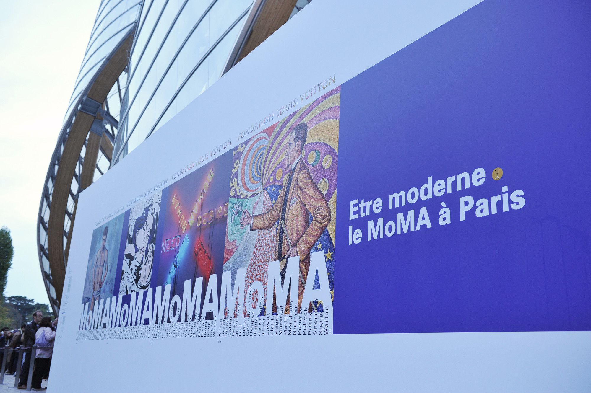 Poster for Être moderne: le MoMA à Paris, installed outside the Fondation Louis Vuitton, Paris