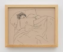 A close-up view of a line drawing in black pen on brown-toned paper in a light wooden frame. The drawing is of a person with tightly coiled curly hair resting in bed while looking at an Apple brand laptop. The figure lays on a pillow with their head propped up by their hand. Their face is mostly obscured by the laptop revealing only one eye. Their body is covered in a blanket. The folds of the blanket take up half of the surface of the drawing.