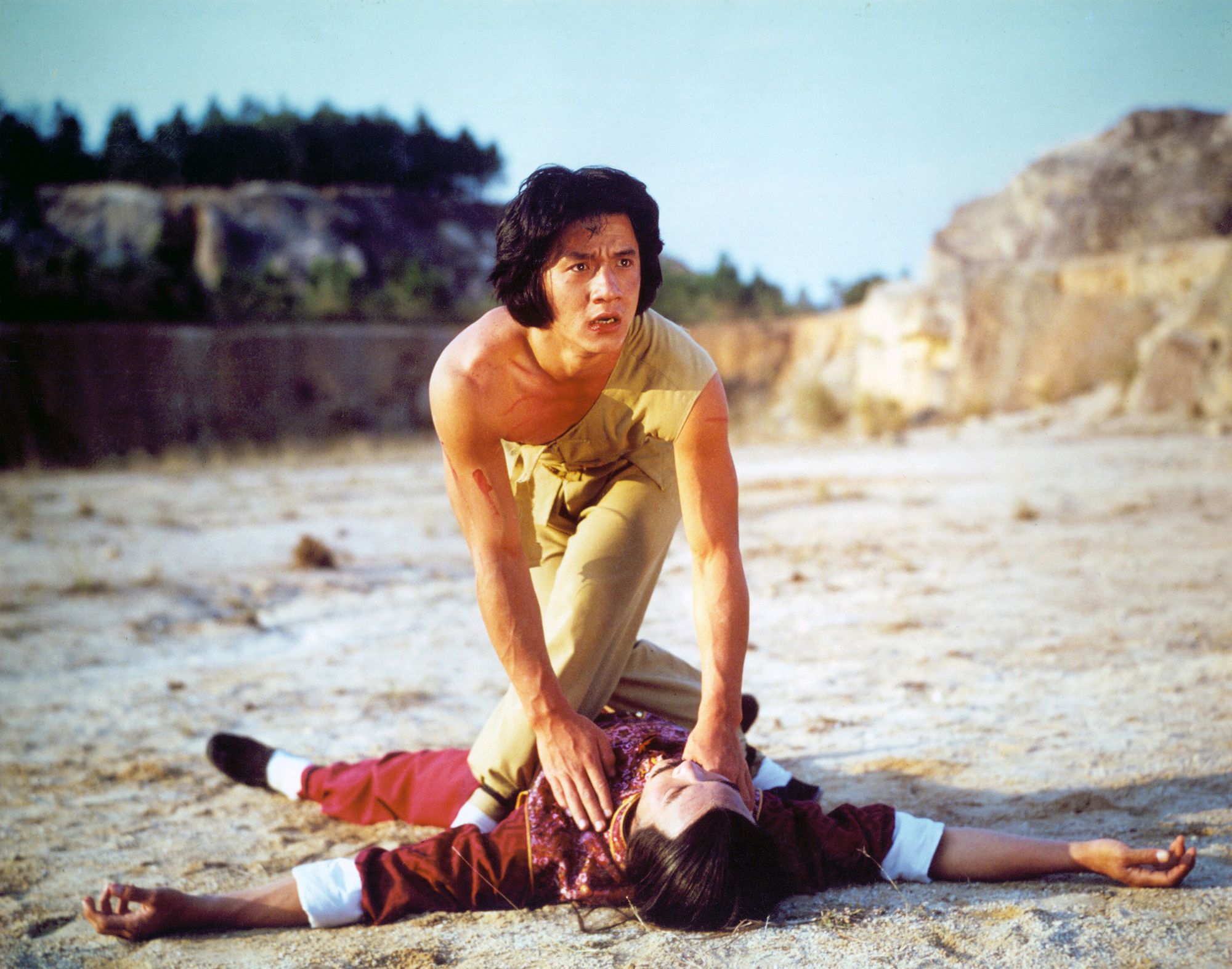 2 men fighting martial arts in a deserted scenario