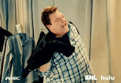 John Goodman in a small coat on SNL