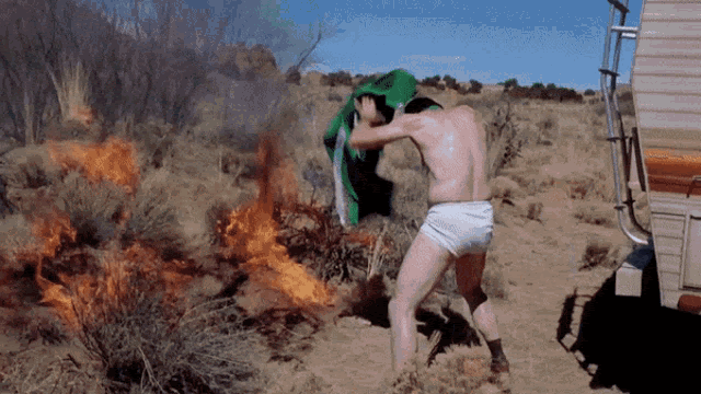Walter White of Breaking Bad putting out a fire gif