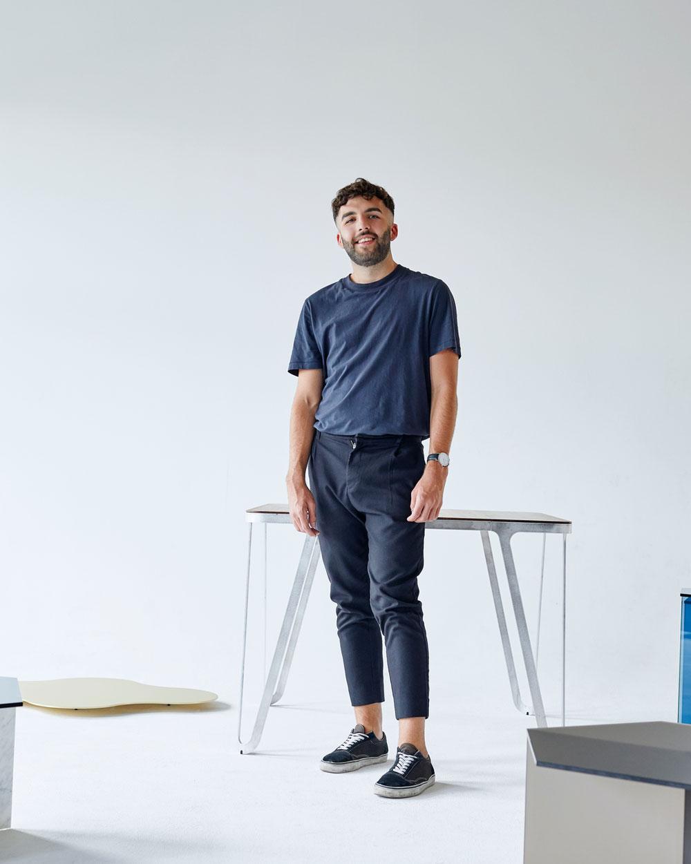A startup employee standing