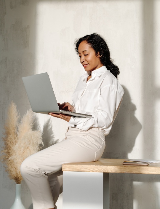 Woman holding laptop
